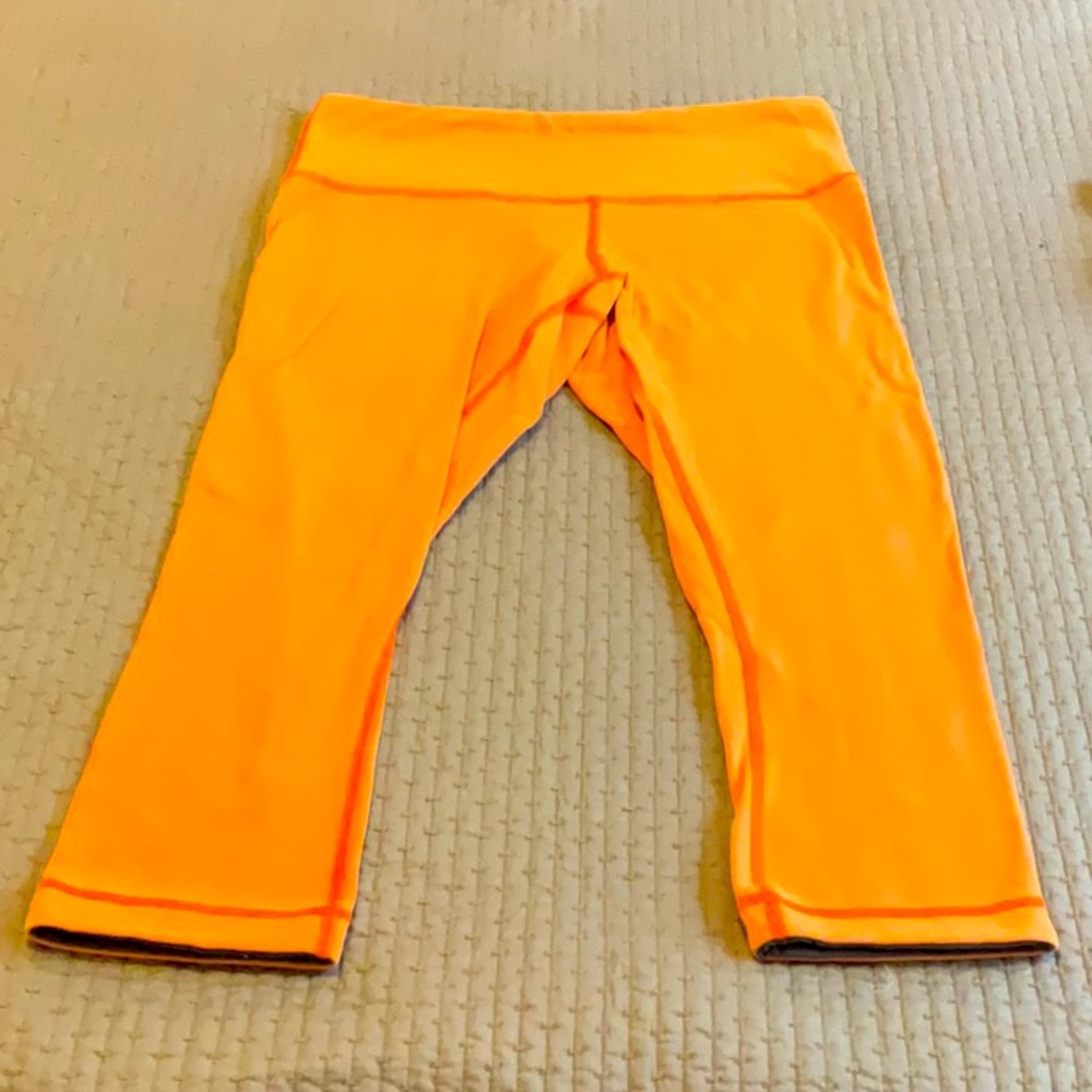 Lululemon workout leggings. Reversible, orange or gray -two pairs in one.